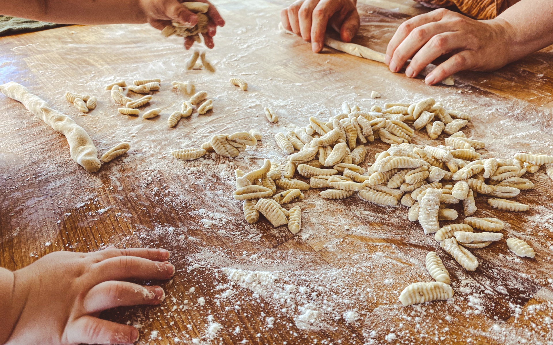 Handmade pasta being prepared for a gathering